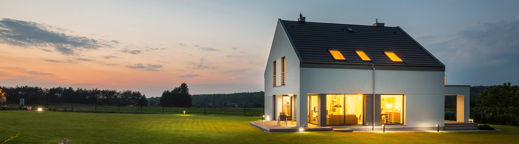 image of a house with lots of windows and a large garden